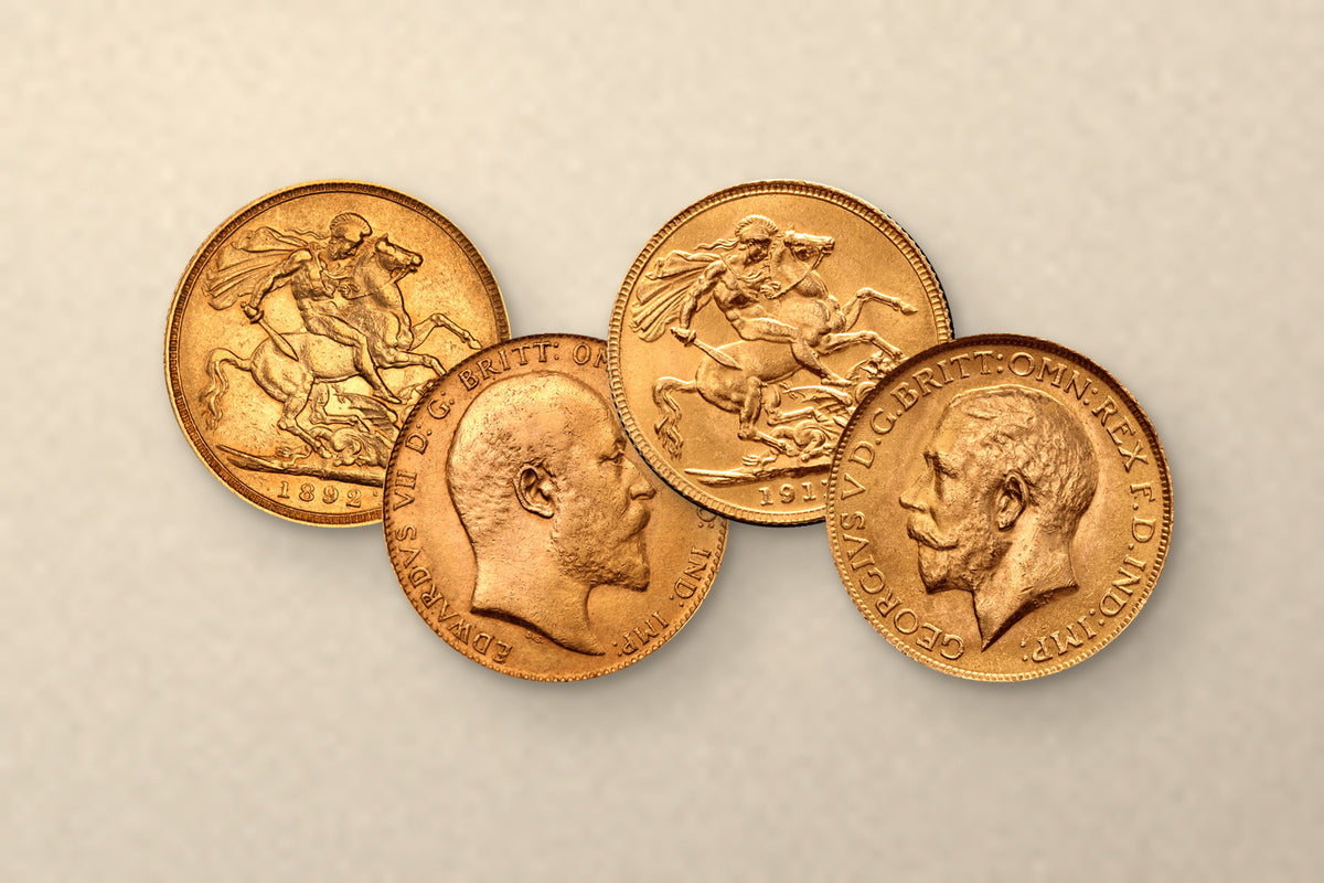 Four gold Sovereigns on cream stone: St George reverses dated 1892 and 1911, and the Edward VII and George V portraits